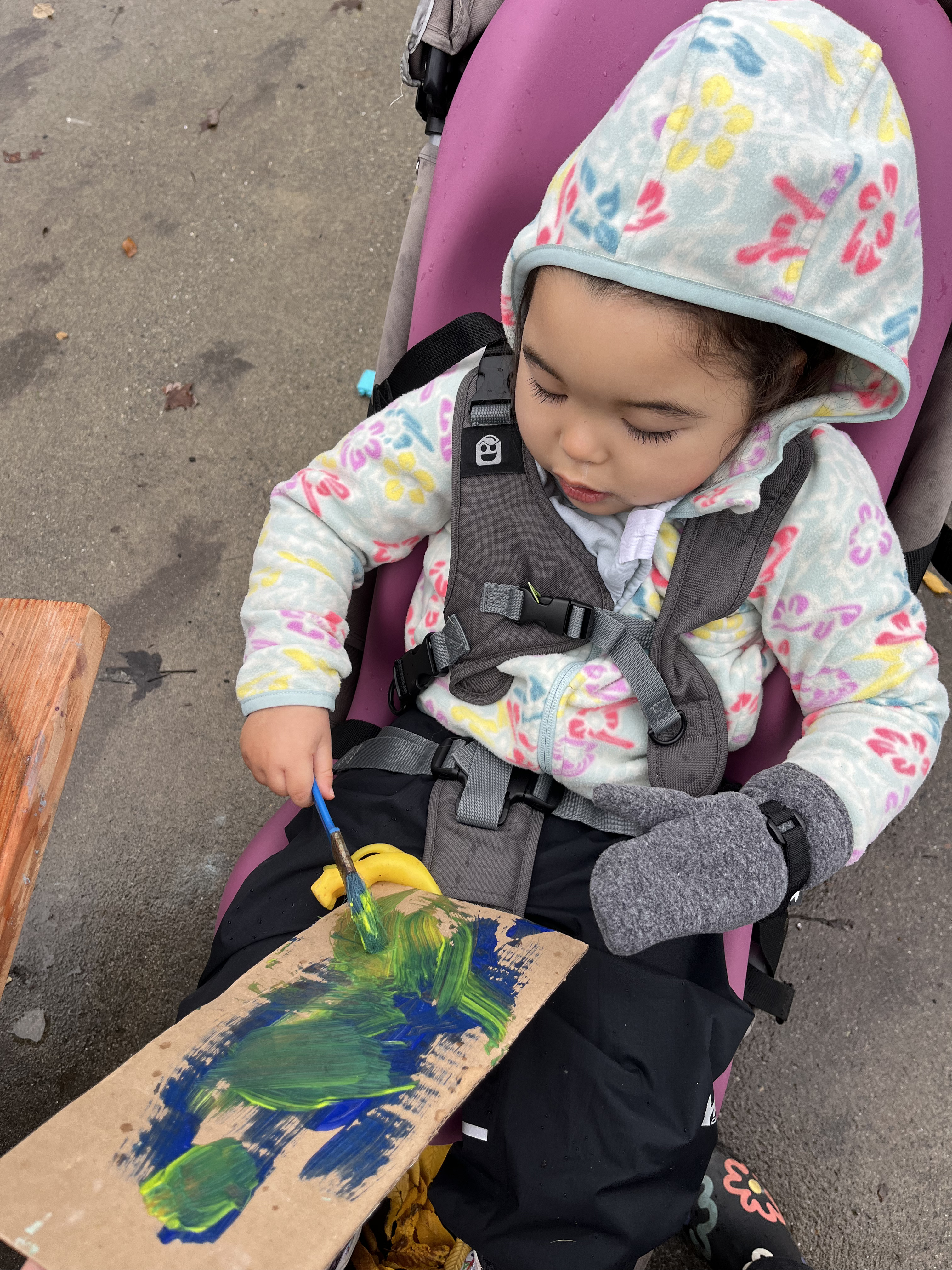 child painting outside